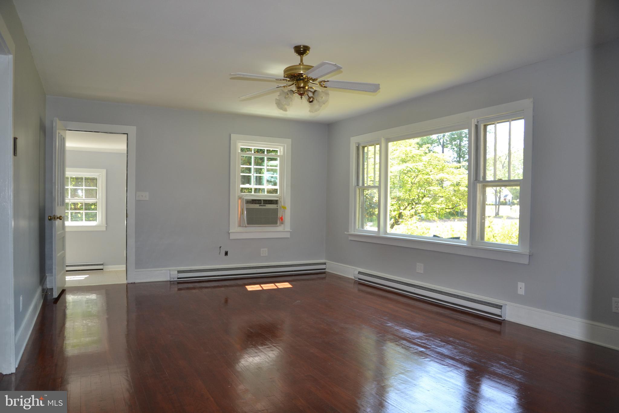 Bright Family room with refinished hardwood flrsl