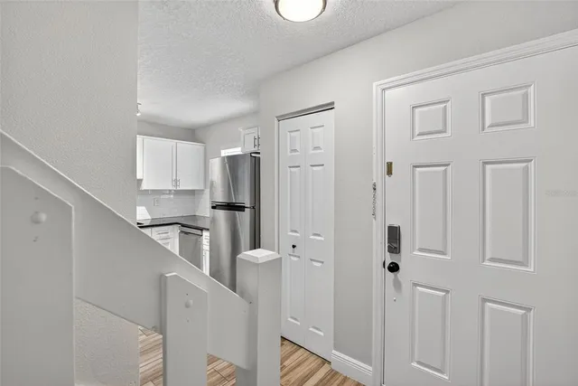 a kitchen with cabinets and stainless steel appliances