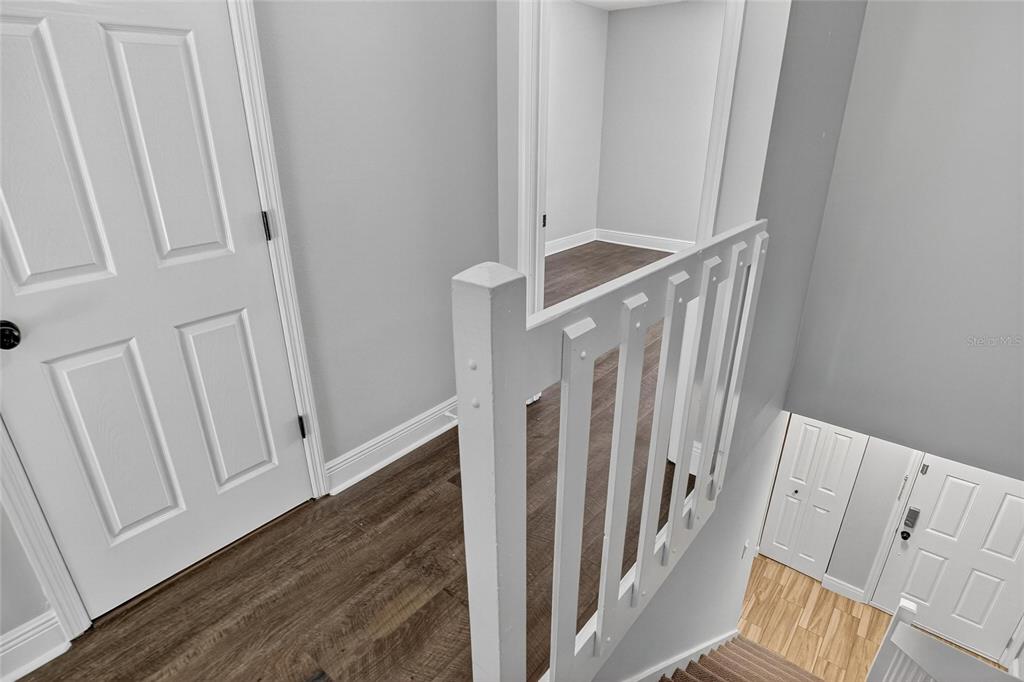 4415 Dylan Loop, Unit 179 Land O' Lakes, FL 34639 - Photo 17 of 50 a view of a hallway with wooden floor and entryway