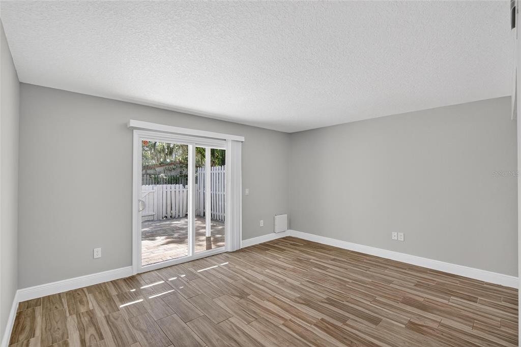4415 Dylan Loop, Unit 179 Land O' Lakes, FL 34639 - Photo 22 of 50 wooden floor in an empty room with a window