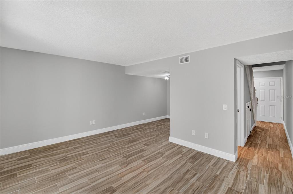 4415 Dylan Loop, Unit 179 Land O' Lakes, FL 34639 - Photo 23 of 50 a view of a room with wooden floor