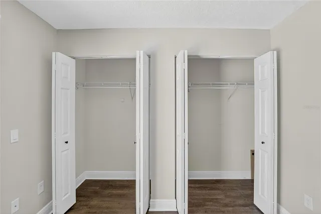 a view of hallway with wooden floor