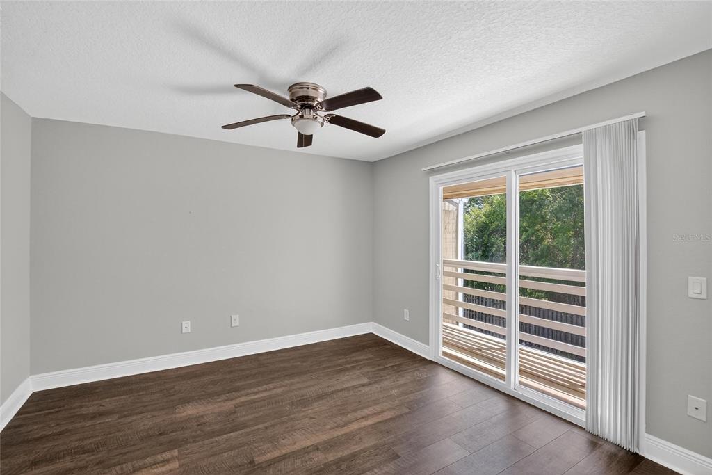 4415 Dylan Loop, Unit 179 Land O' Lakes, FL 34639 - Photo 29 of 50 wooden floor in an empty room with a window