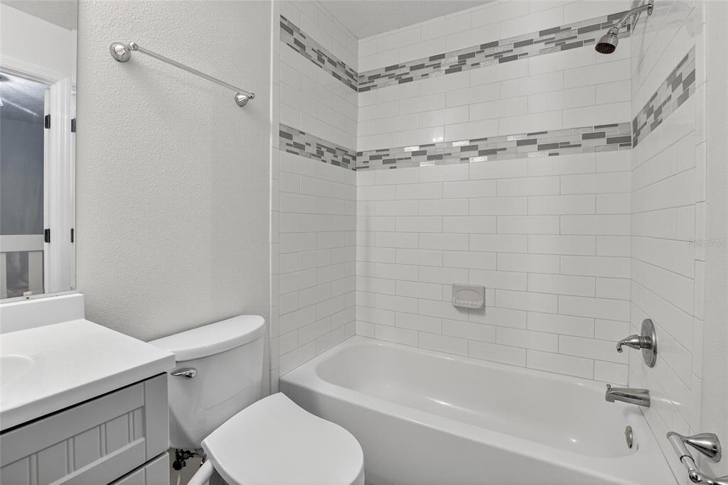 4415 Dylan Loop, Unit 179 Land O' Lakes, FL 34639 - Photo 30 of 50 a bathroom with a shower a toilet and bathtub