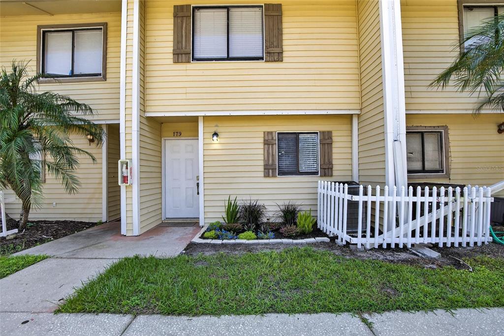 4415 Dylan Loop, Unit 179 Land O' Lakes, FL 34639 - Photo 3 of 50 a front view of a house with a yard