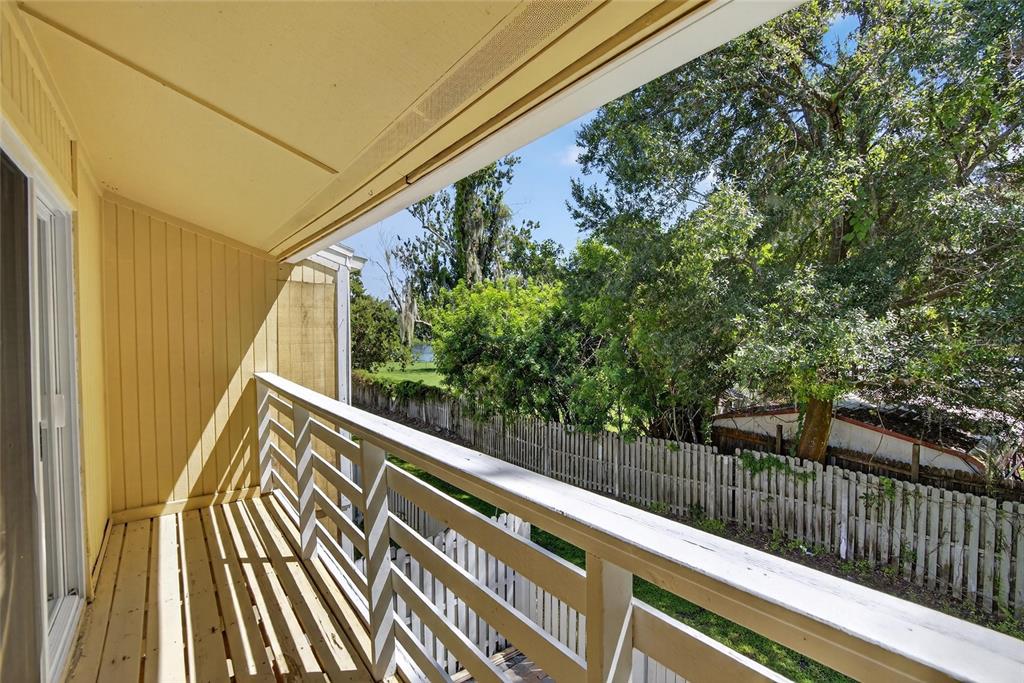 4415 Dylan Loop, Unit 179 Land O' Lakes, FL 34639 - Photo 39 of 50 a view of balcony with wooden floor and fence