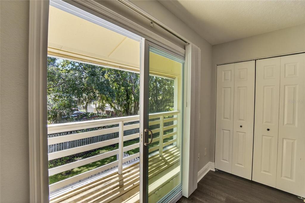 4415 Dylan Loop, Unit 179 Land O' Lakes, FL 34639 - Photo 40 of 50 a view of a bedroom with wooden floor and windows