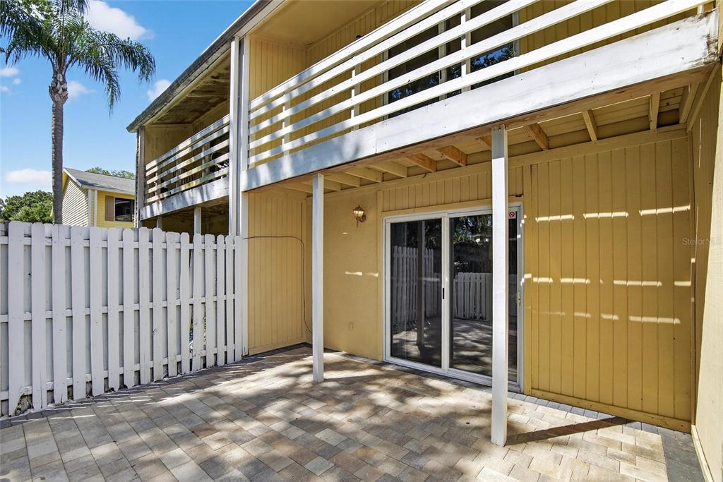 4415 Dylan Loop, Unit 179 Land O' Lakes, FL 34639 - Photo 42 of 50 a view of a house with a door and wooden fence
