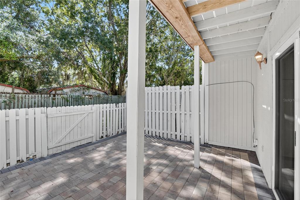 4415 Dylan Loop, Unit 179 Land O' Lakes, FL 34639 - Photo 43 of 50 a view of a entrance gate with a small yard