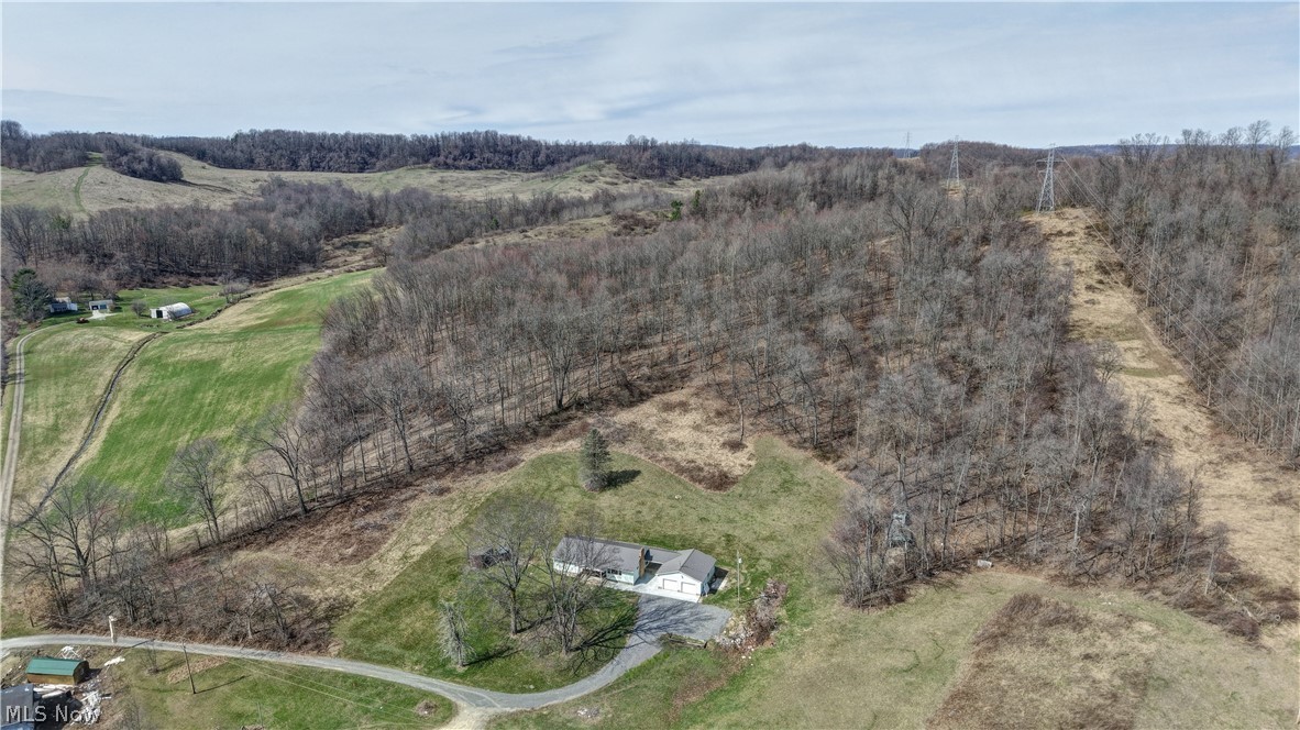3265 York View Road Southwest New Philadelphia, OH 44663 - Photo 24 of 45 Aerial view of sparsely populated area with a heavily wooded area