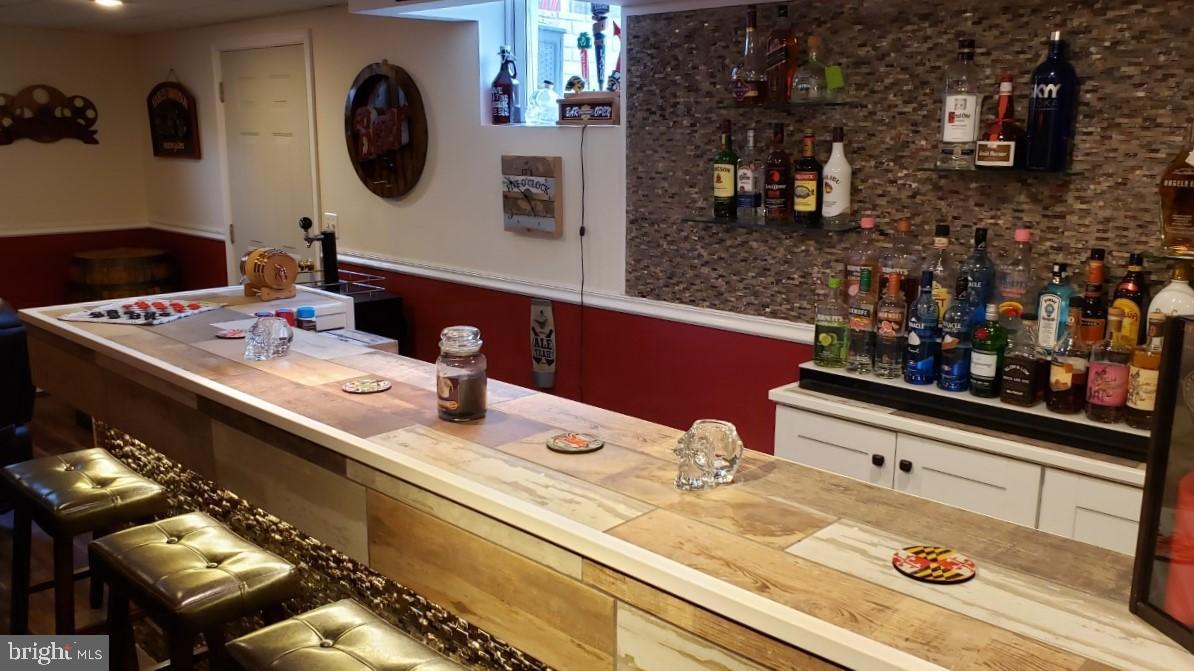 8250 Blossom Point Road Welcome, MD 20693 - Photo 31 of 54 Bar stools and kegerator convey!