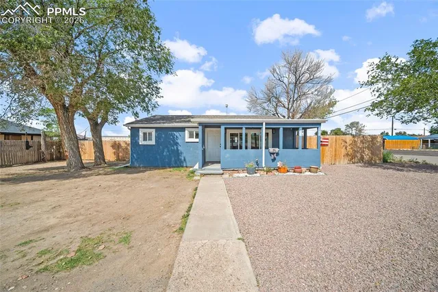 a view of house with outdoor space and sitting area