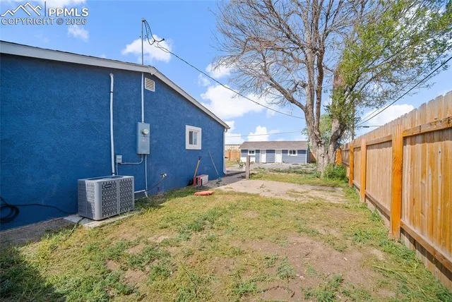 a view of house with yard