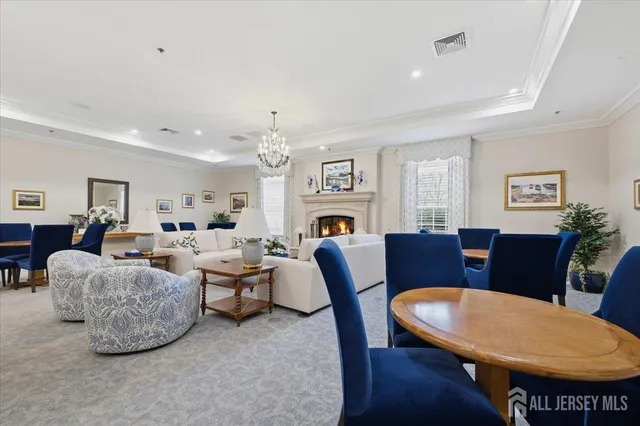 a living room with furniture a dining table and a dining table