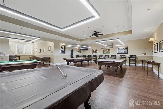 a living room with lots of furniture and kitchen view