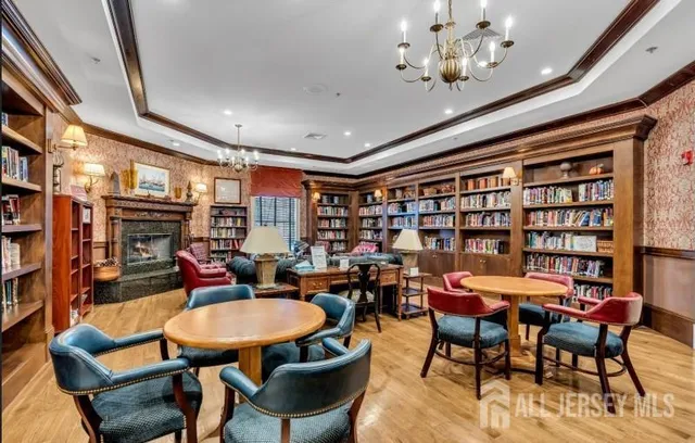 a outdoor dining space with furniture and chandelier