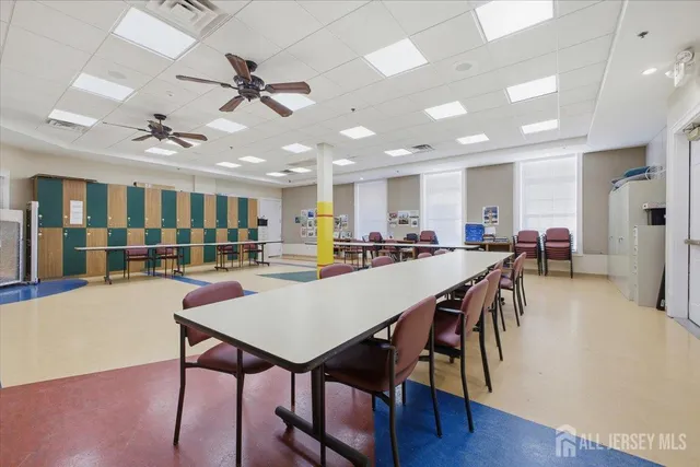 a view of a dining area with furniture and a table