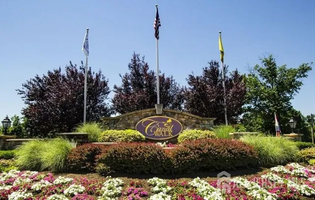 a view of a garden with a house