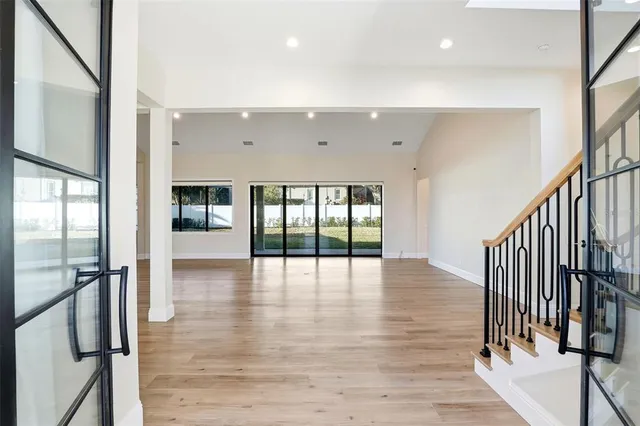 a view of an entryway with wooden floor