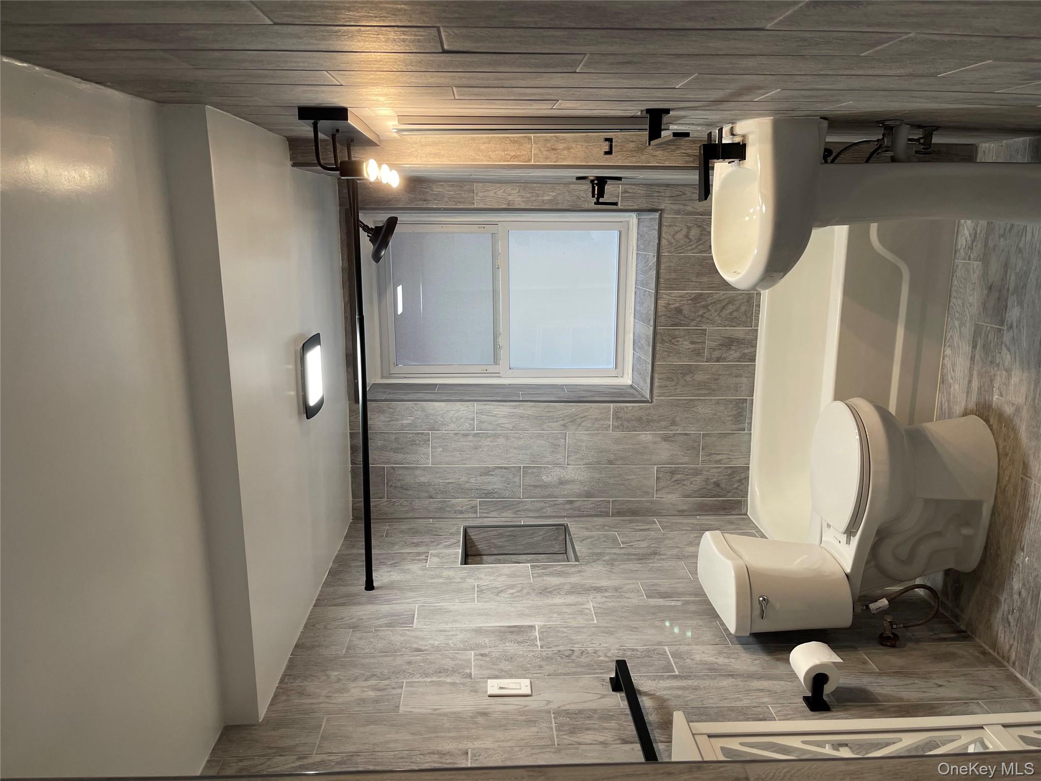 5783 Mosholu Avenue Bronx, NY 10471 - Photo 14 of 17 a bathroom with a sink and a mirror