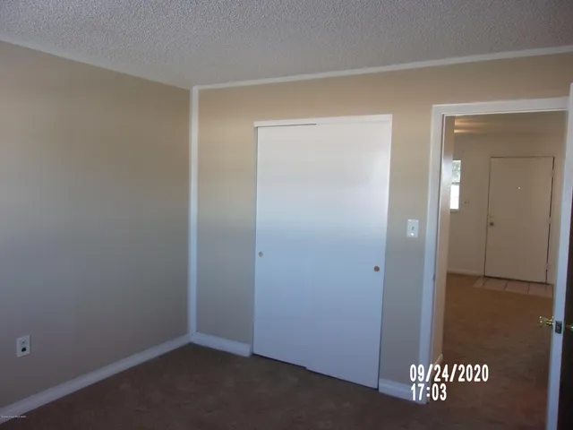 an empty room with a wooden door
