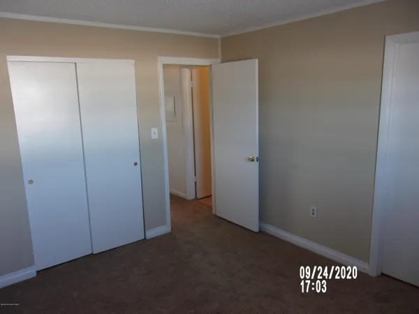 an empty room with a wooden door