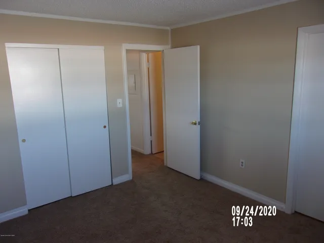 an empty room with a wooden door