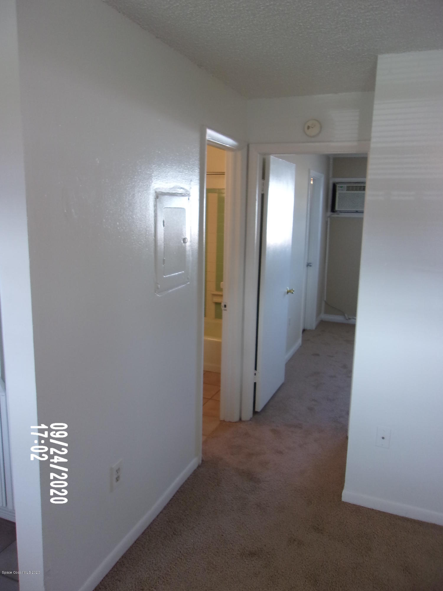 1713 Dixon Boulevard, Unit 156 Cocoa, FL 32922 - Photo 6 of 12 a view of a hallway with wooden floor