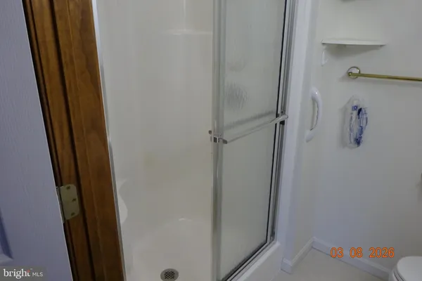 a white toilet sitting next to a bathroom sink