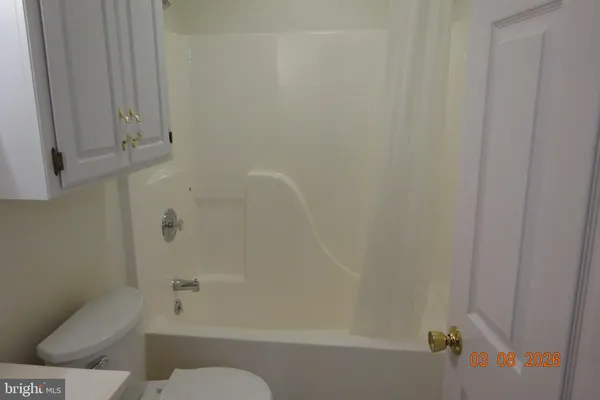 a bathroom with a toilet and shower