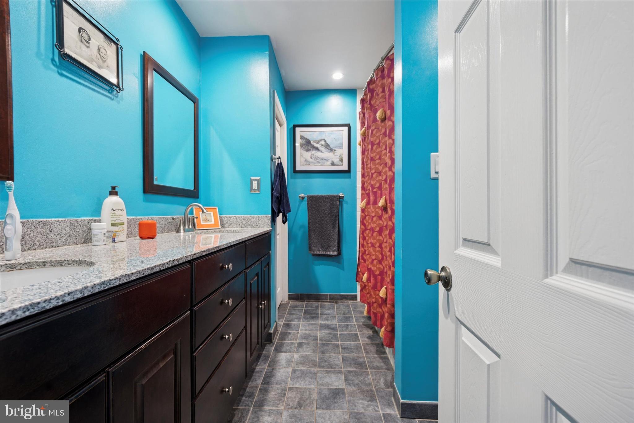 2935 South 13th Street Philadelphia, PA 19148 - Photo 14 of 24 a bathroom with sinks and a shower