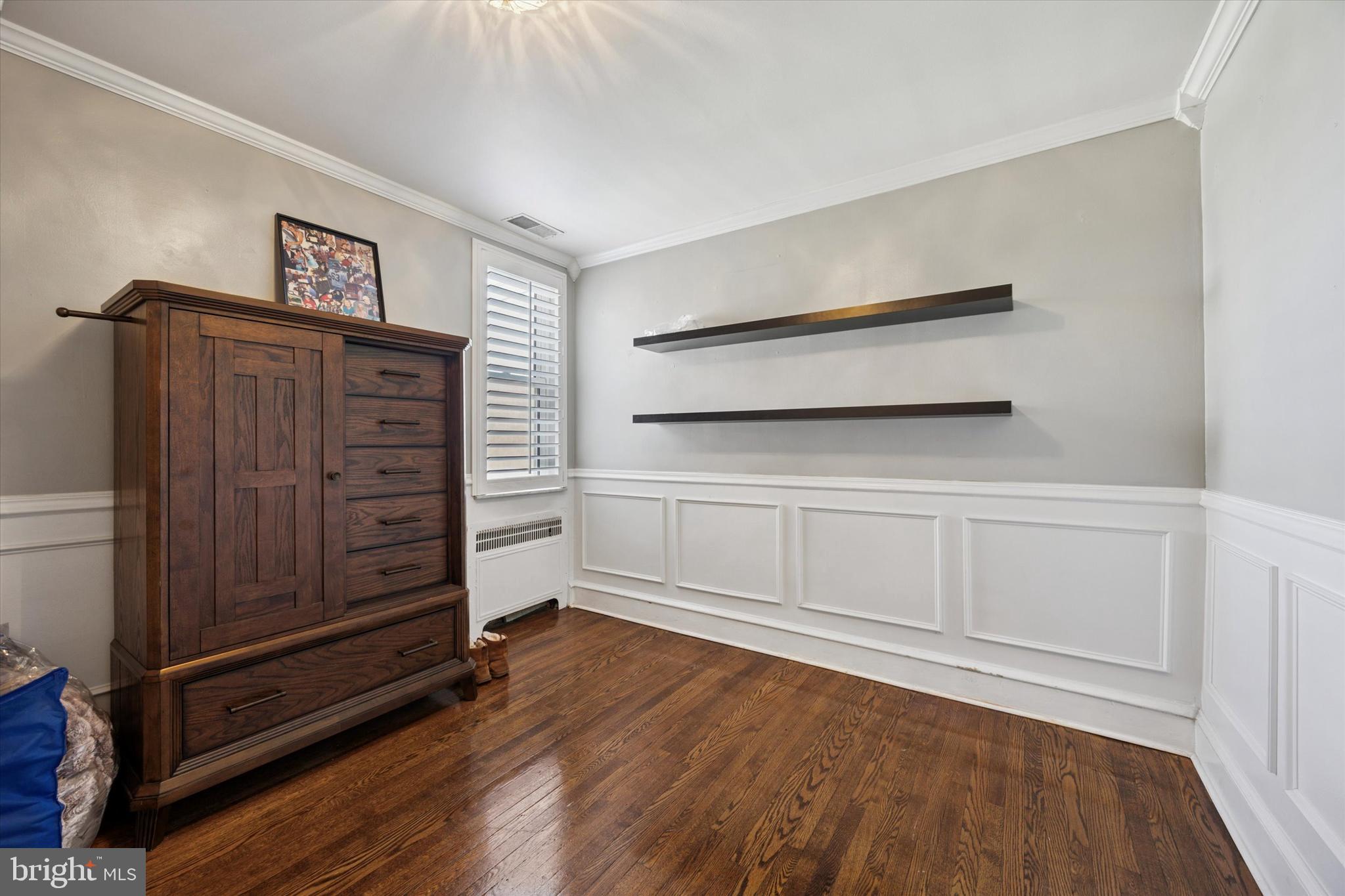 2935 South 13th Street Philadelphia, PA 19148 - Photo 18 of 24 a view of an empty room with wooden floor