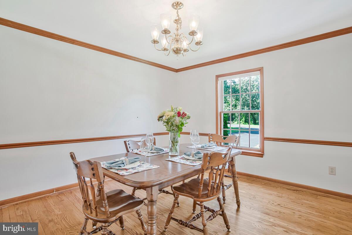 626 Fairmount Road Linthicum Heights, MD 21090 - Photo 17 of 58 a view of a dining room with furniture and chandelier