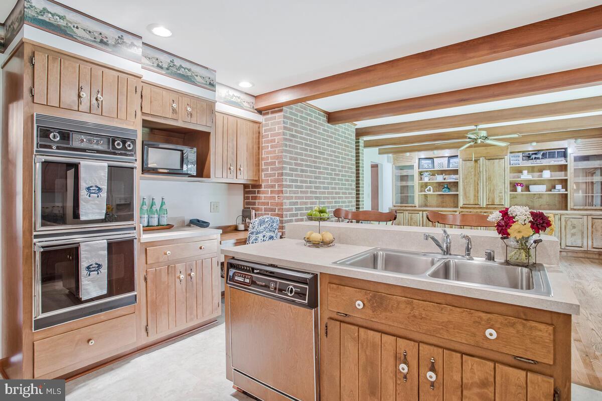 626 Fairmount Road Linthicum Heights, MD 21090 - Photo 24 of 58 a kitchen with stainless steel appliances granite countertop a sink and a stove