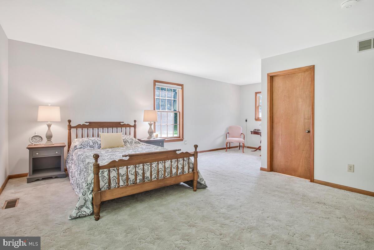 626 Fairmount Road Linthicum Heights, MD 21090 - Photo 32 of 58 a bed room with a bed and a chair