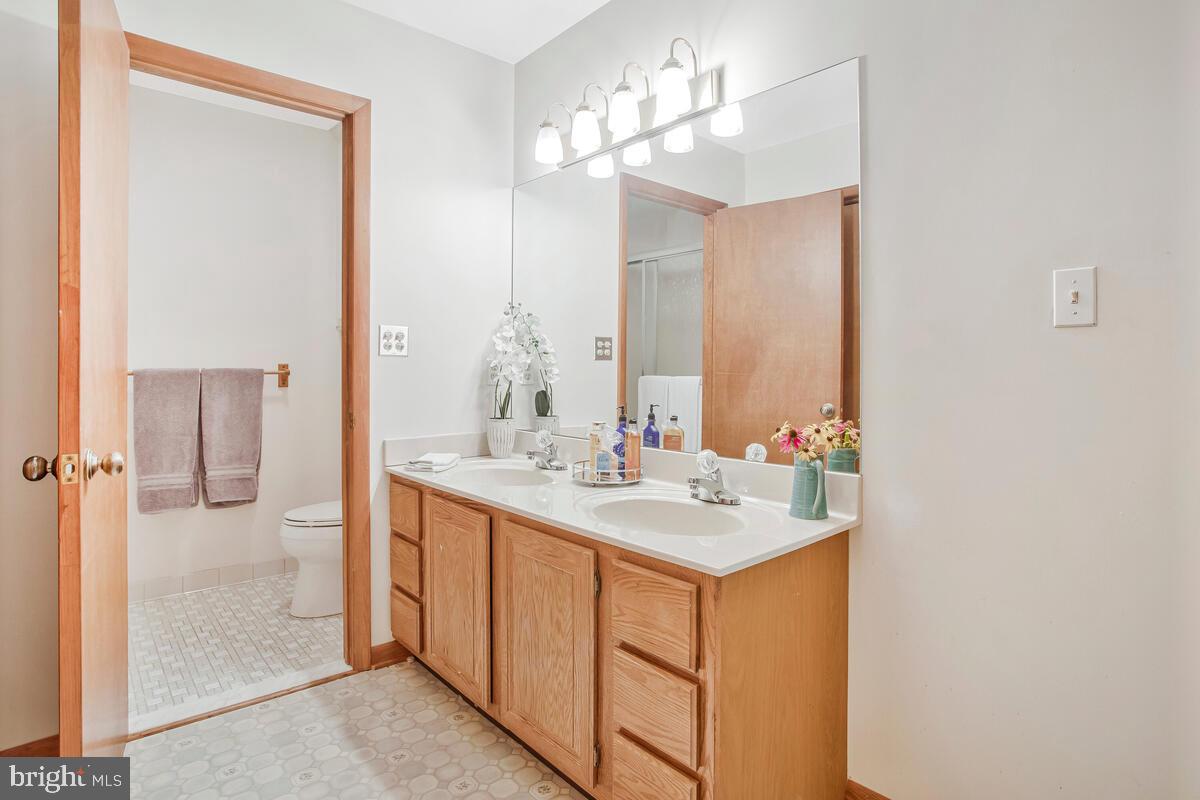 626 Fairmount Road Linthicum Heights, MD 21090 - Photo 35 of 58 a bathroom with a sink a mirror and a shower