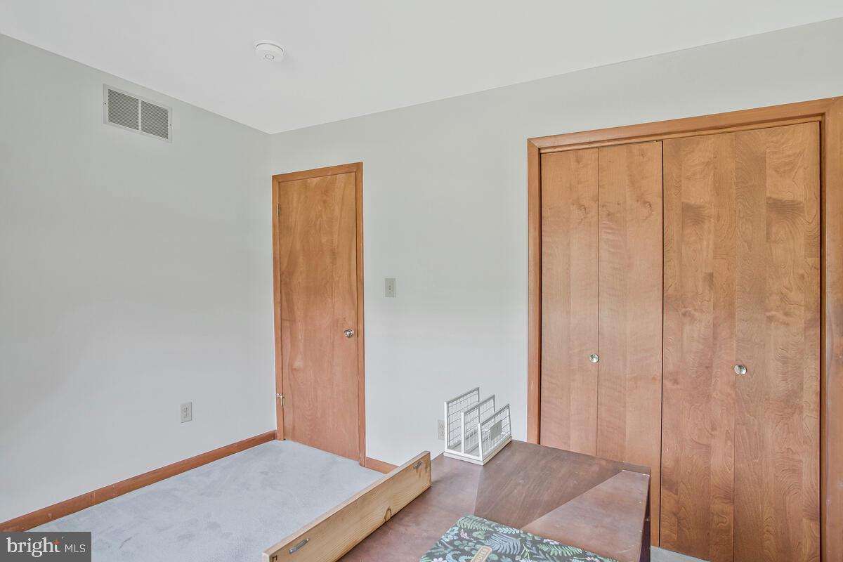 626 Fairmount Road Linthicum Heights, MD 21090 - Photo 44 of 58 a bedroom with a bed and a gate