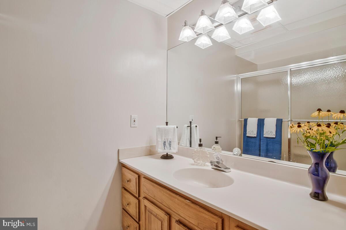 626 Fairmount Road Linthicum Heights, MD 21090 - Photo 50 of 58 a bathroom with a sink and a mirror