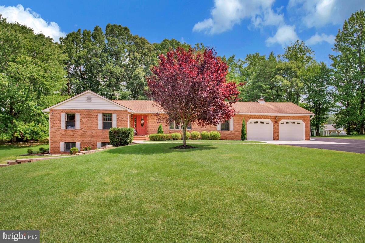 626 Fairmount Road Linthicum Heights, MD 21090 - Photo 10 of 58 a front view of a house with a garden and trees