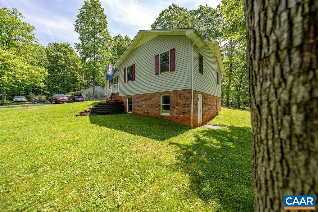 41 Sweet Pea Road Ruckersville, VA 22968 - Photo 54 of 69 a view of a house with backyard and sitting area