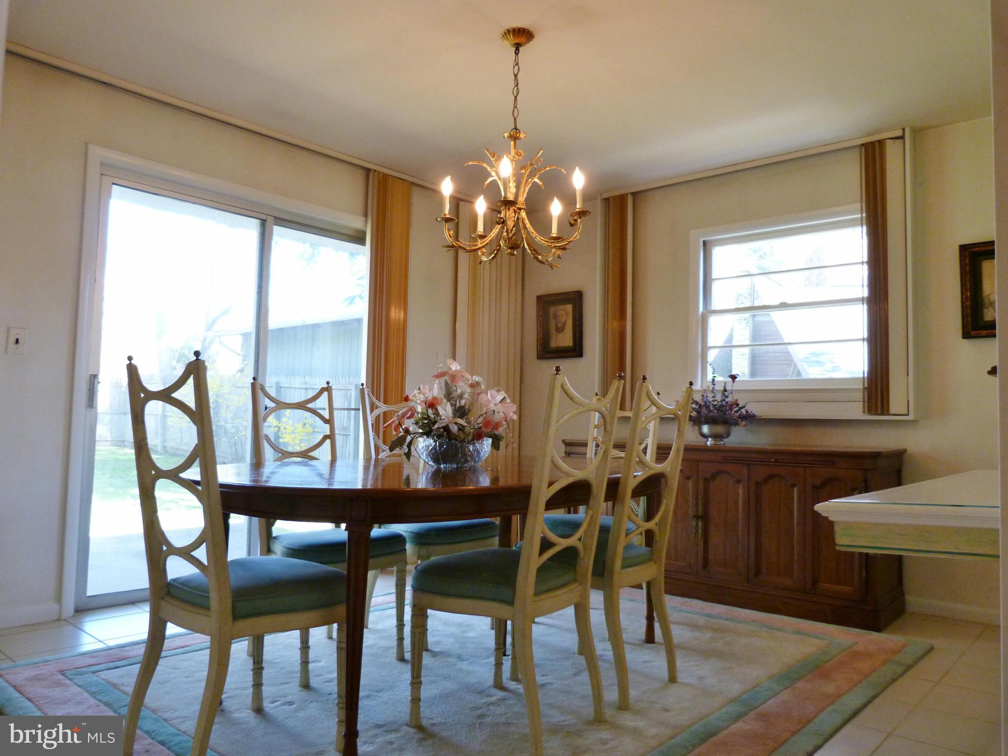 9508 Midwood Road Silver Spring, MD 20910 - Photo 6 of 10 a view of a dining room with furniture window and outside view