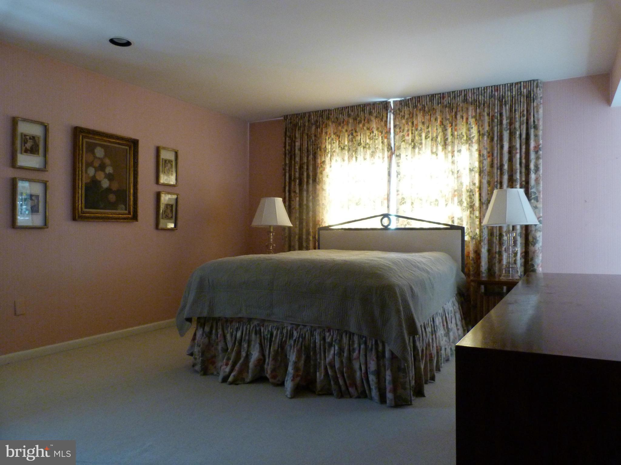 9508 Midwood Road Silver Spring, MD 20910 - Photo 7 of 10 a bedroom with a bed and a window