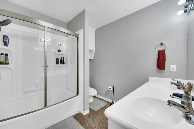 a bathroom with a sink and shower