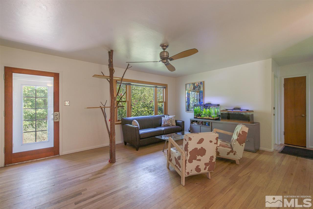 1945 Keystone Avenue Reno, NV 89503 - Photo 3 of 14 a living room with furniture and a large window