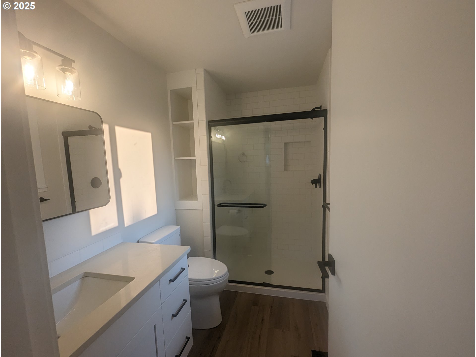 8009 Southwest Mapleleaf Street Portland, OR 97223 - Photo 16 of 16 a bathroom with a granite countertop sink toilet and shower