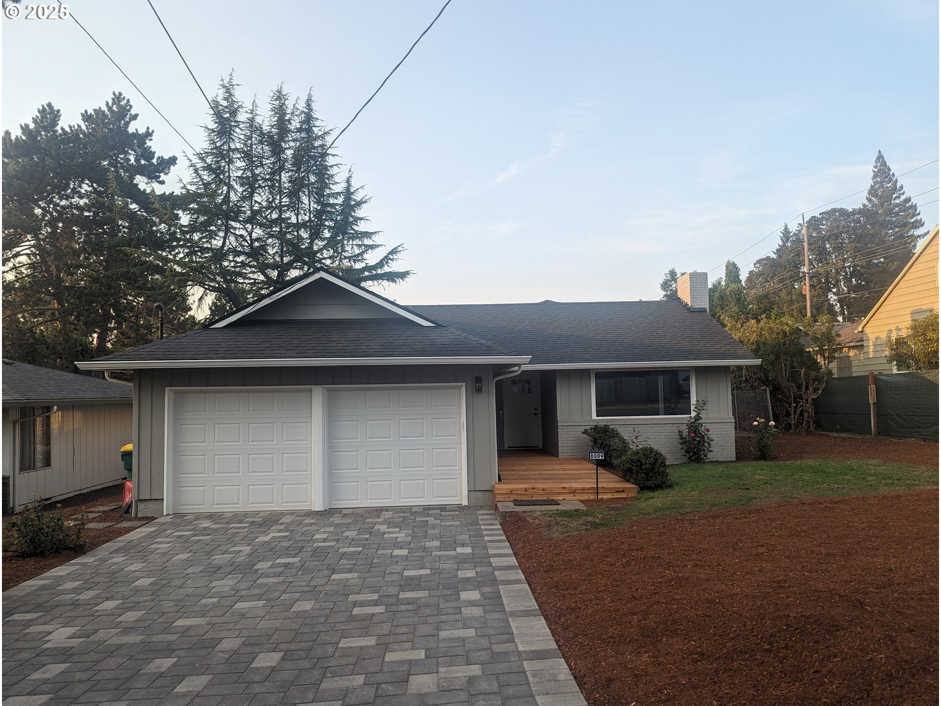 8009 Southwest Mapleleaf Street Portland, OR 97223 - Photo 2 of 16 a front view of house with yard and trees around