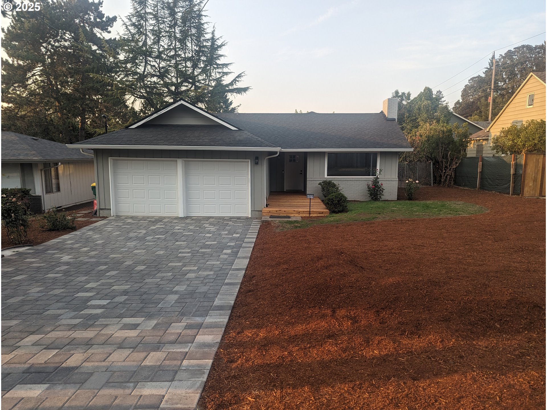 8009 Southwest Mapleleaf Street Portland, OR 97223 - Photo 3 of 16 a front view of a house with yard and parking