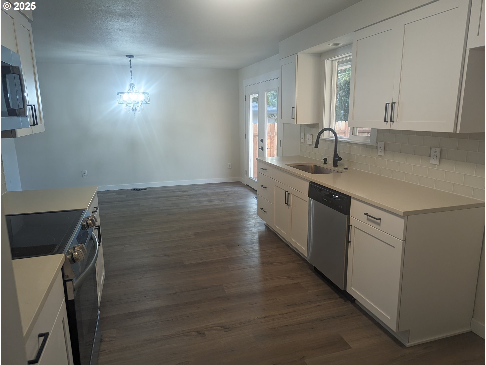 8009 Southwest Mapleleaf Street Portland, OR 97223 - Photo 5 of 16 a kitchen with a sink and cabinets