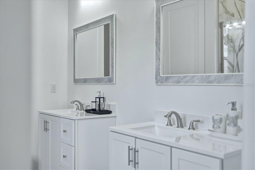 1215 Rio De Janeiro Avenue Punta Gorda, FL 33983 - Photo 50 of 65 a bathroom with a sink and a mirror
