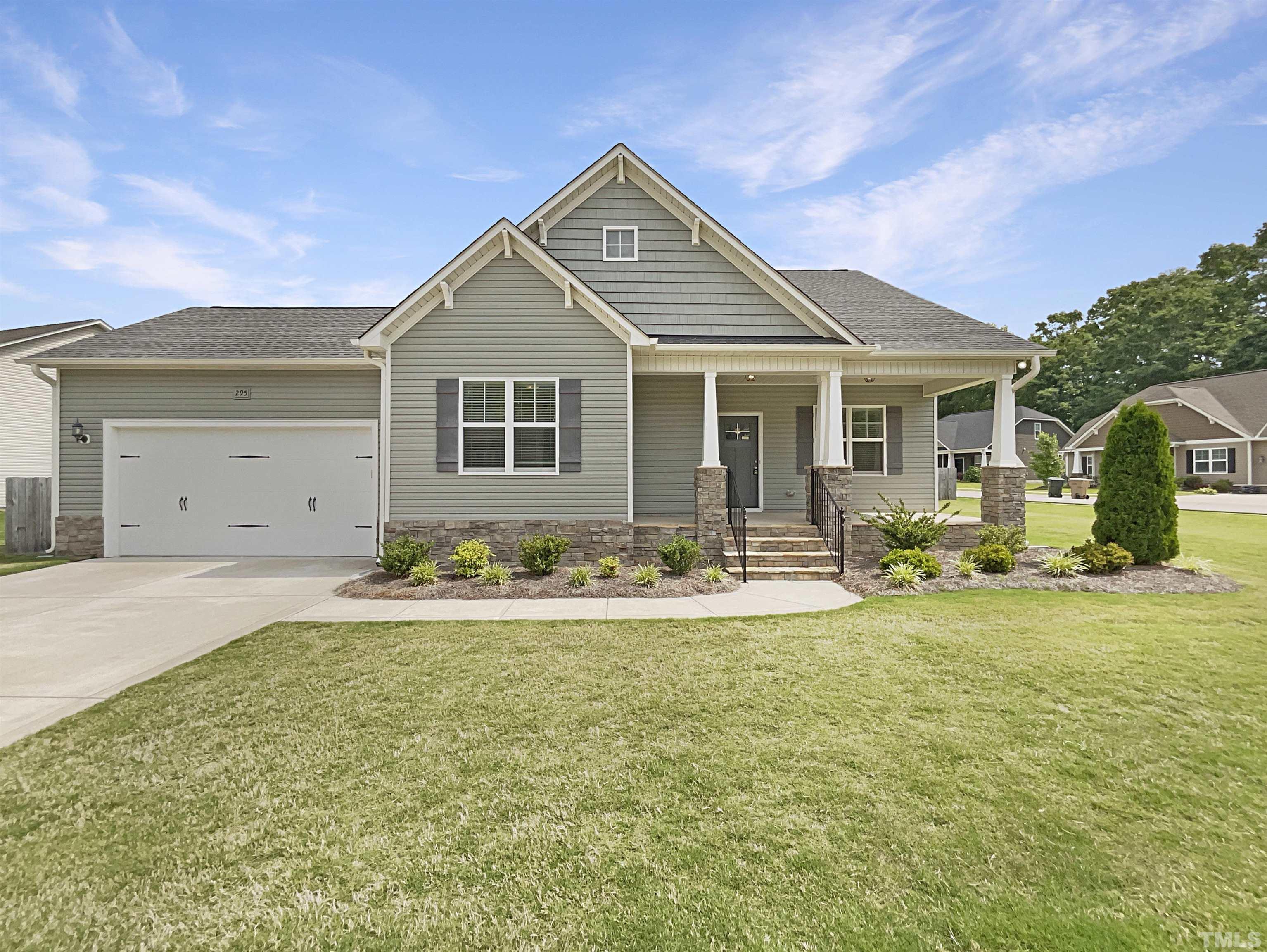 295 Edgefield Street Clayton, NC 27520 - Photo 1 of 21 a front view of house with yard and green space